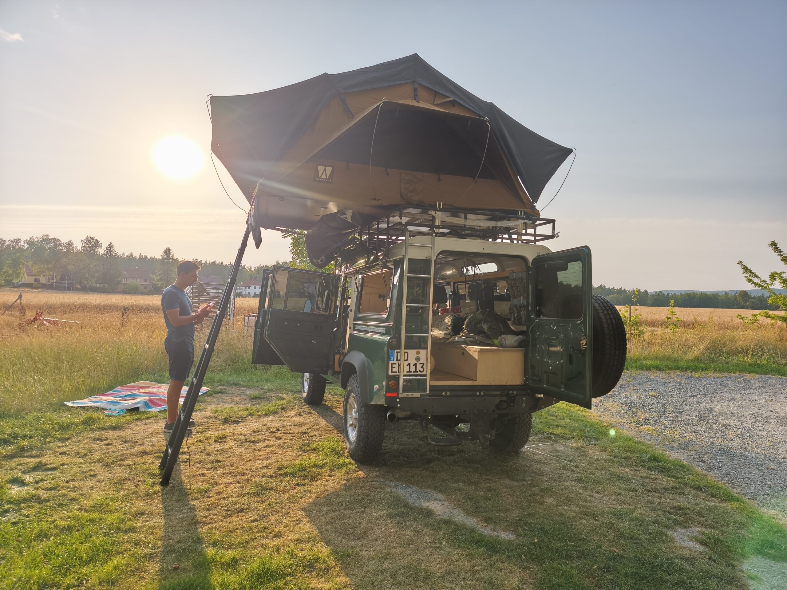 Defender camping set up completly unpacked at the camp site