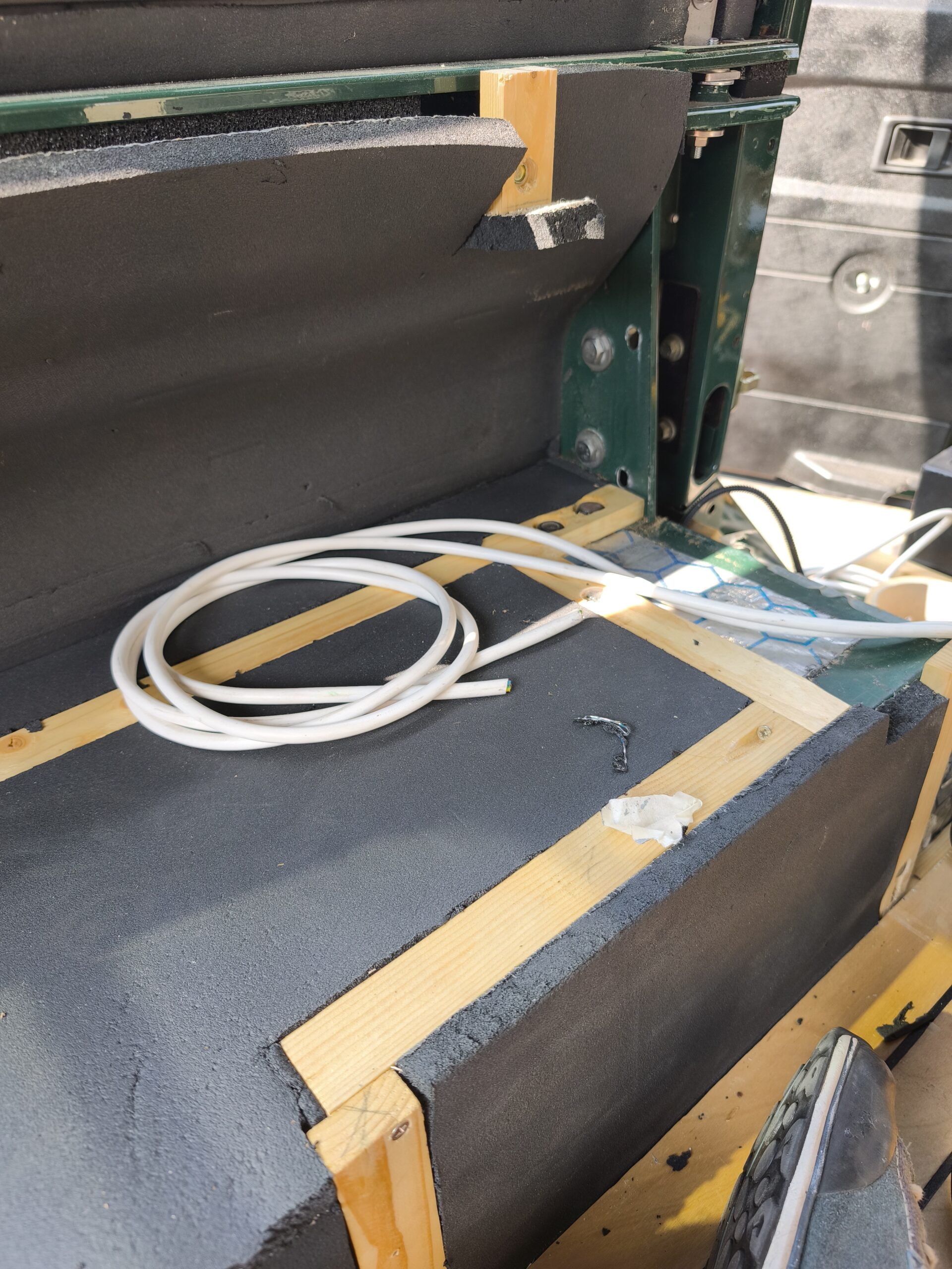 construction underneath the wooden panels using all the existing holes inside tha car chassis