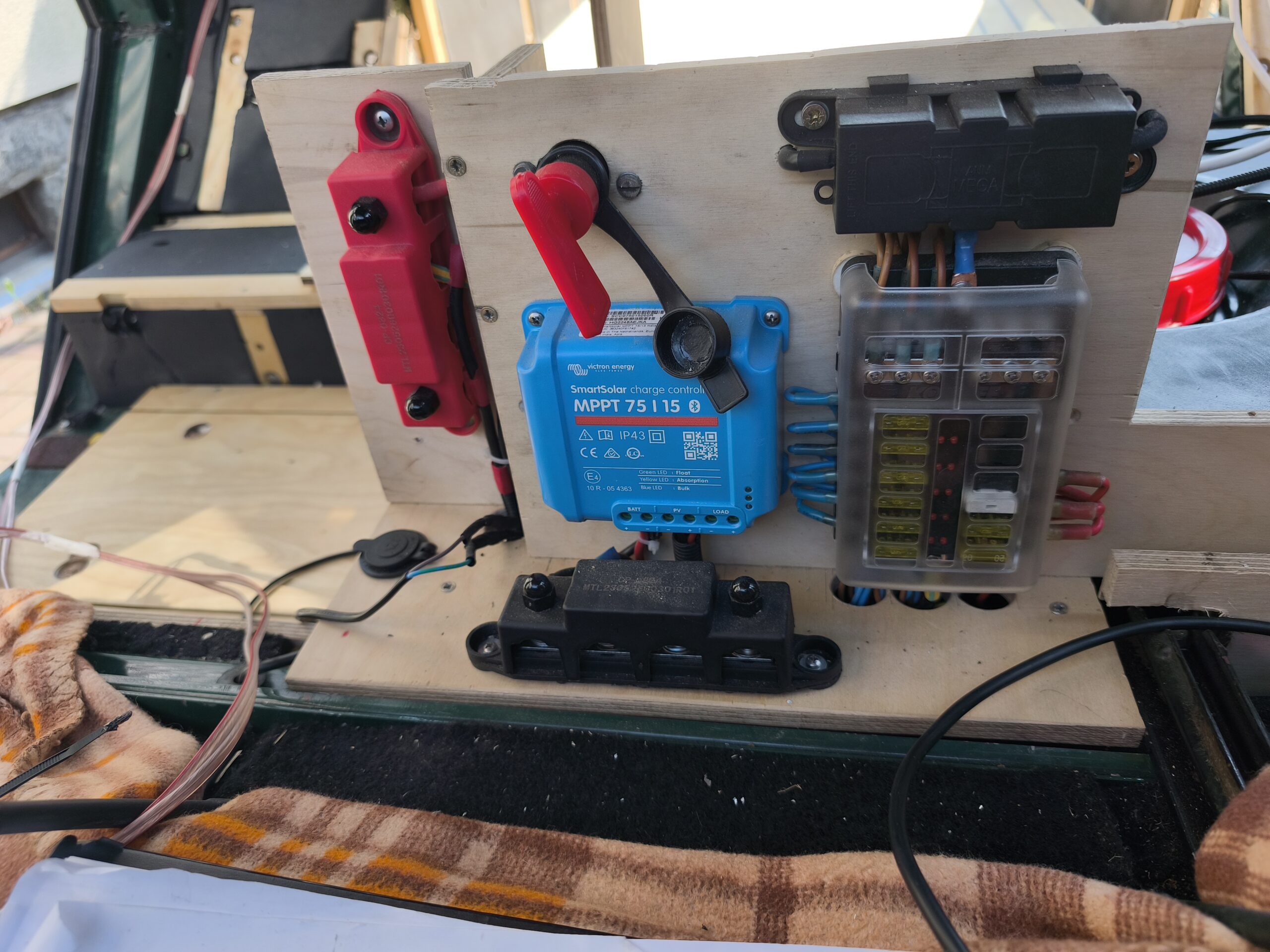 electrical boards with solar charge controller, main switch, and fuse box/distribution block