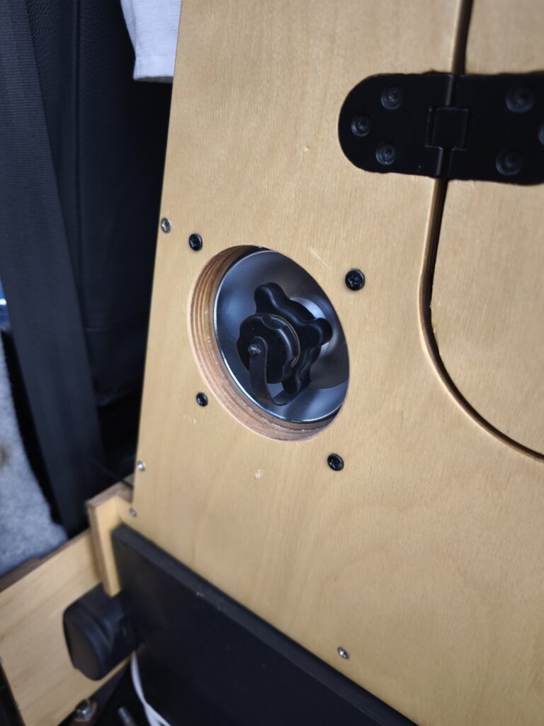 Water filler neck on the door behind the driver