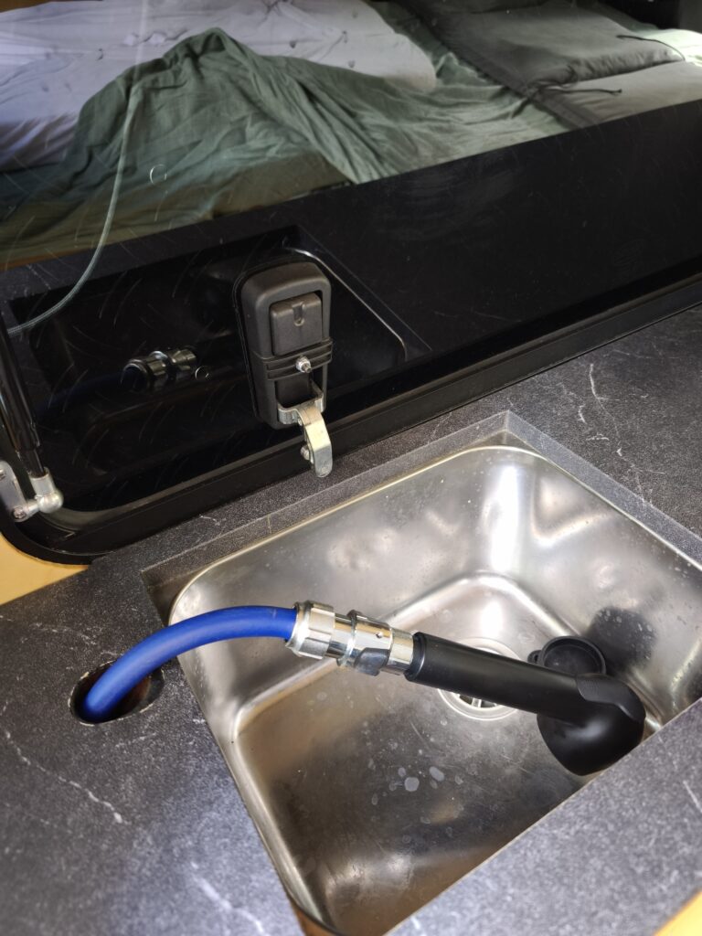 extended hand shower for outdoor showering