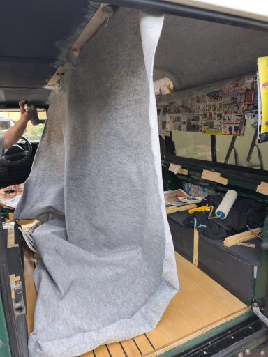 Spraying the 19mm Armaflex with glue to attach the headliner to it