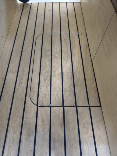Wooden floor cover for fast accessing the fuel tank beneath the car